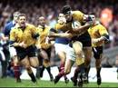 John Eales bursts forward with the ball