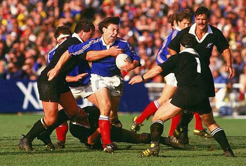 French fly-half Franck Mesnel runs at the New Zealand defence