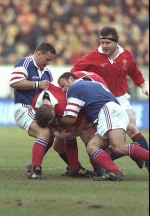 Scott Quinnell is stopped by the French defence