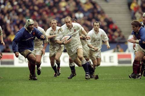 Lawrence Dallaglio charges at the French defence.