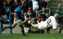 Will Greenwood beats the Italian defence to score.