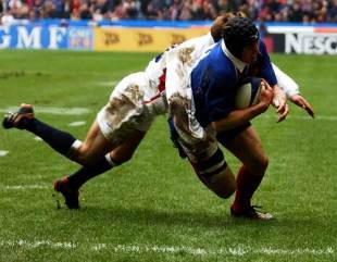 Flanker Imanol Harinordoquy rides an English tackle to score for France, France v England, Six Nations, Stade de France, March 2 2002.