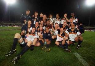 The Brumbies celebrate with the 2001 Super 12 trophy after their 36-6 win over the Sharks, Brumbies v Sharks, Super 12 final, Canberra Stadium, May 26 2001.