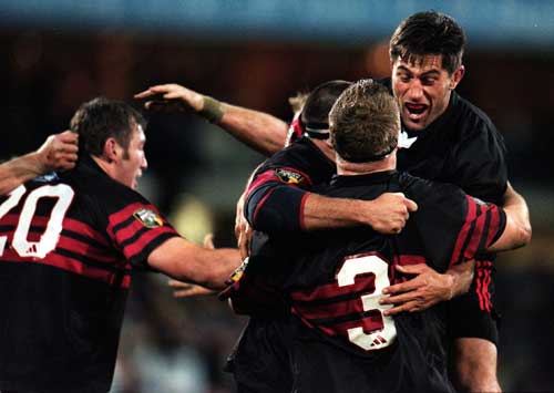 Crusaders players celebrate the final whistle