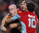 The Chiefs' Brendan Leonard is tackled by the Crusaders' Dan Carter