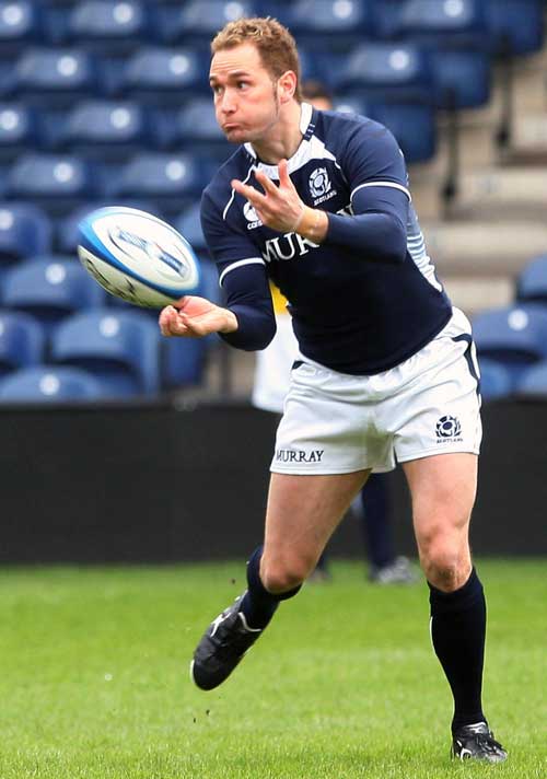 Scotland fly-half Dan Parks off loads the ball