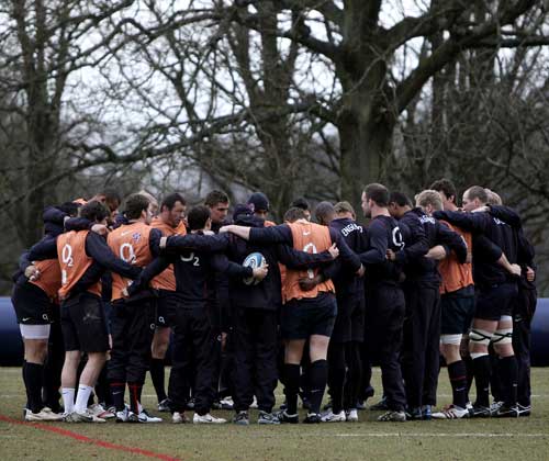 The England squad comes in for a huddle during training
