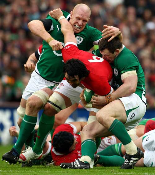 Wales' Jonathan Thomas is shackled by the Irish defence