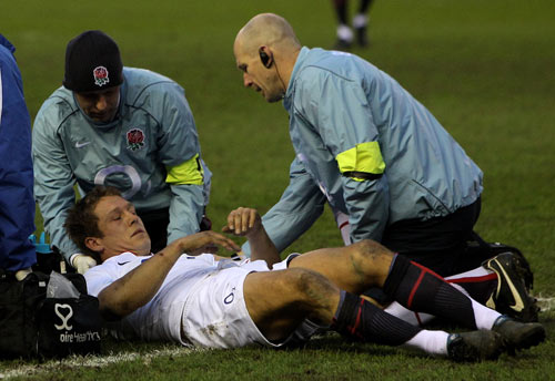 Jonny Wilkinson receives treatment after taking a heavy knock