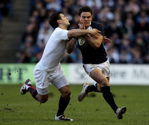 Scotland's Max Evans is tackled by Danny Care
