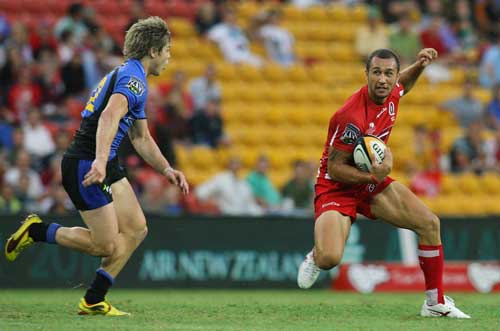Reds fly-half Quade Cooper takes on Force centre James O'Connor