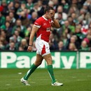 Wales fullback Lee Byrne trudges from the field after being sin-binned