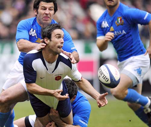 France scrum-half Morgan Parra offloads in the tackle