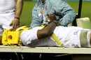 England wing Ugo Monye is carried from the field on a stretcher