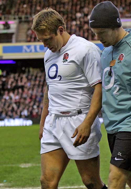 England's Jonny Wilkinson limps off injured
