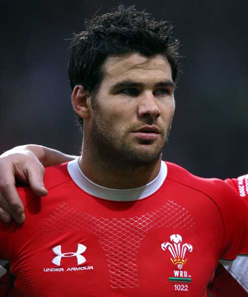 Wales scrum-half Mike Phillips stands during the national anthems