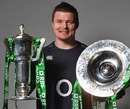 Ireland captain poses with the Six Nations Trophy and the Triple Crown silverware