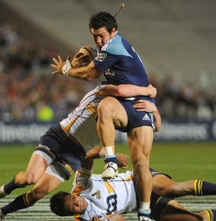 The Blues' Rene Ranger high steps his way through the Brumbies' defence, Blues v Brumbies, Super 14, Eden Park, Auckland, New Zealand, March 19, 2010