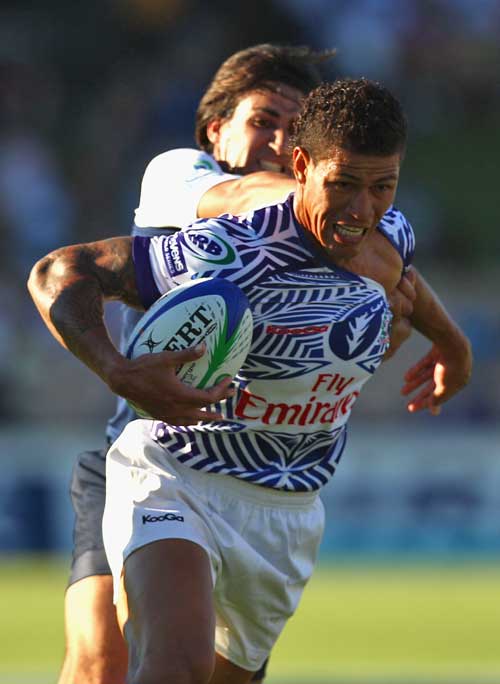 Samoa's Mikaele Pesamino is tackled by France's Paul Albaladejo 