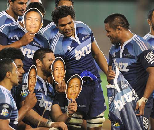 The Blues' Keven Mealamu is surrounded by his team-mates 