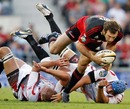 The Crusaders' Adam Whitelock breaches the Lions' defence