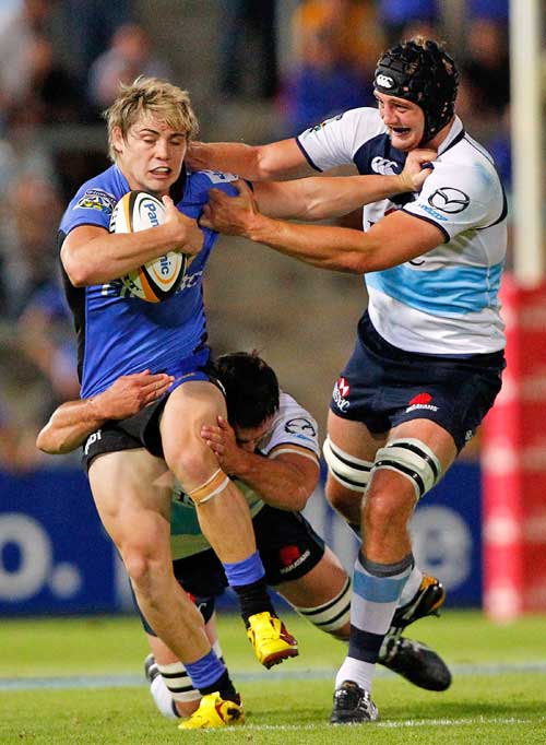 Western Force centre James O'Connor is held by the Waratahs