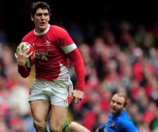 Wales' James Hook races away from the Italian defence at the Millenium Stadium, Cardiff, Wales, March 20, 2010