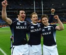 Kelly Brown, Dan Parks and Chris Cusiter celebrate Scotland's win over Ireland