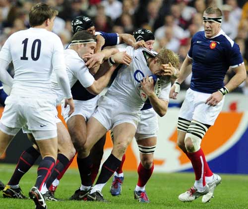 England flanker Lewis Moody is shackled by the French defence