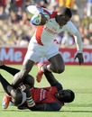 England's Christian Wade crashes through the Kenya defence