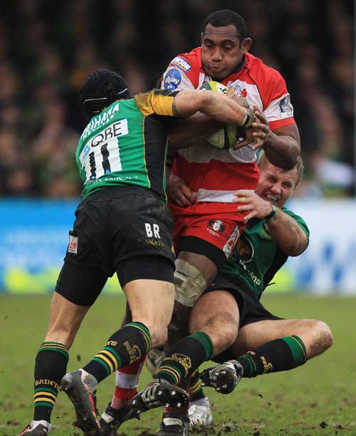 Gloucester's Apo Satala is wrapped up by the Northampton defence