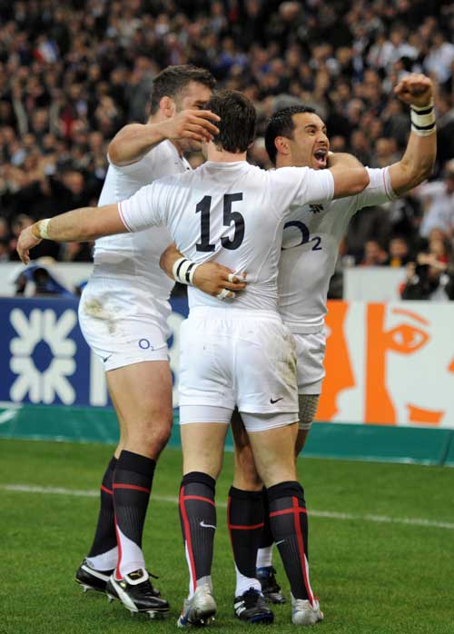 Riki Flutey and Nick Easter congratulate Ben Foden following his try