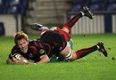 Edinburgh's Roddy Grant dives over to score