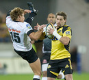 The Hurricanes' Cory Jane fends off Patrick Lambie