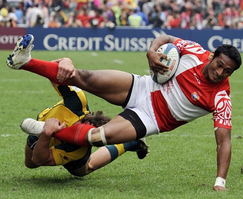 Tonga's Jack Ram is upended by Australia's Liam Gill