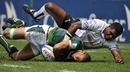 South African's Ryno Benjamin is tackled by Fiji's Etonia Naba