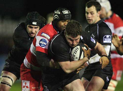 Newcastle hooker Rob Vickers grapples against the Gloucester defence