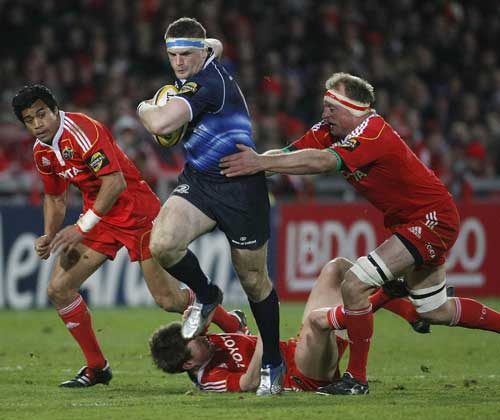 Leinster No.8 Jamie Heaslip is tackled by Mick O'Driscoll