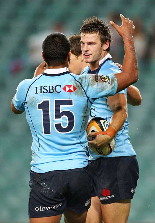 The Waratahs' Rob Horne is congratulated on scoring a try
