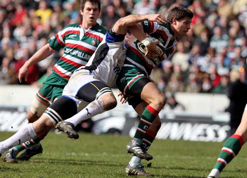 Leicester's Ben Youngs is snagged by Bath's Julian Slavi