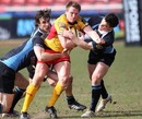 The Dragons' Jason Tovey is shackled by the Glasgow defence