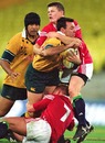Australia's Joe Roff is tackled by the Lions' Brian O'Driscoll