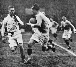 France wing Adolphe Jaureguy takes on the England defence, France v England, Five Nations, Stade Olympique Yves-du-Manoir, Colombes, Paris, April 2, 1927