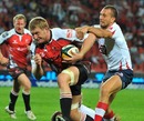 The Lions'  Franco van der Merwe stretches the Reds' defence