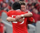 Munster's Ronan O'Gara and Lifeimi Mafi celebrate victory over Northampton