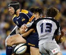 The Brumbies' Julian Huxley loses the ball in contact