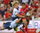 The Reds' Will Genia is shackled by the Bulls defence