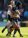 Worcester's Sam Tuitupou is tackled by Wasps' Tom Rees