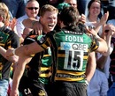 Northampton's Chris Ashton celebrates scoring a try