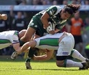 The Leeds defence combine to fell London Irish's George Stowers